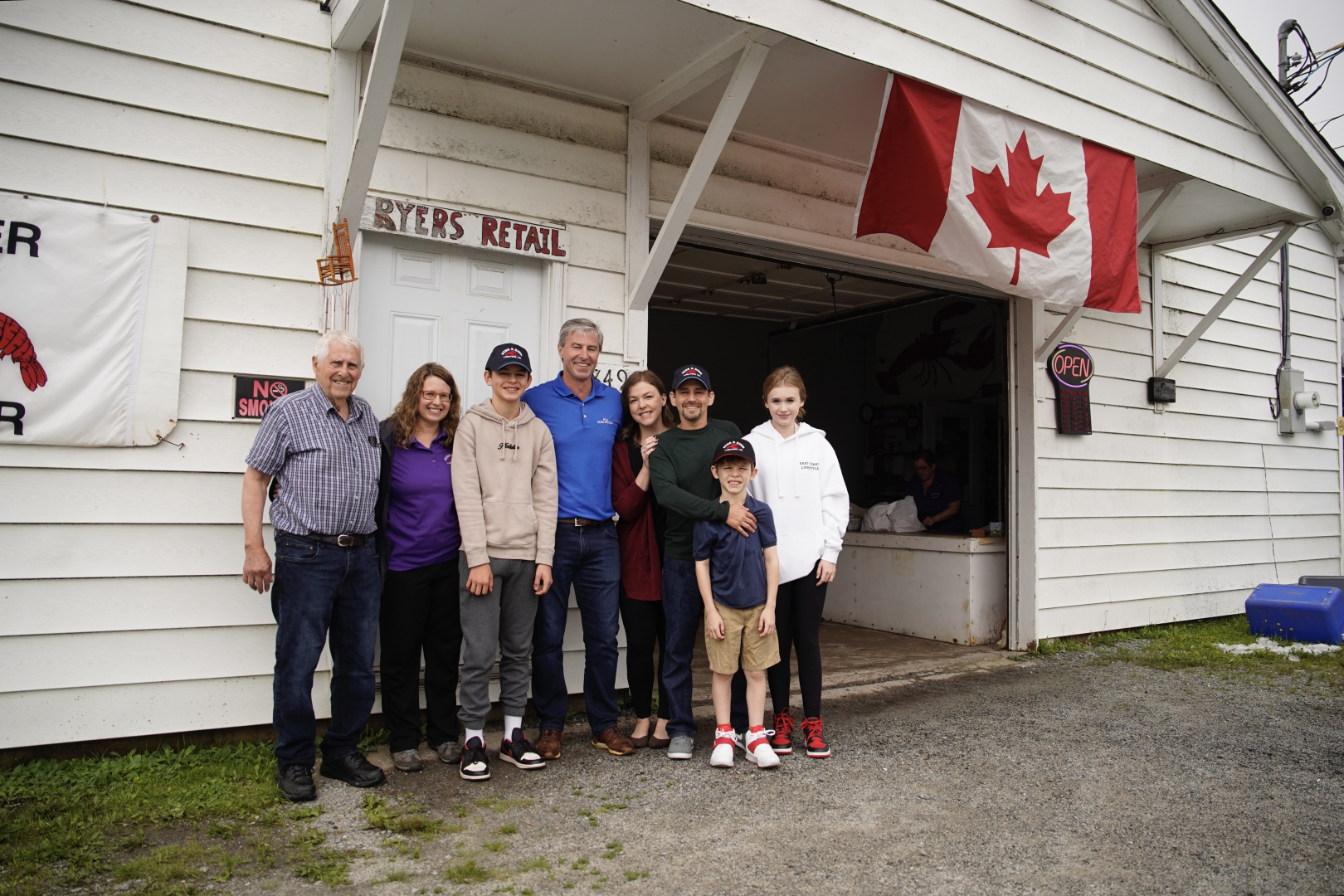 Premier Tim Houston (middle) stands with the Ryer Family at their family-run business Ryer & Ryer Lobster Ltd., in Indian Harbour. Premier Houston will be promoting Nova Scotia's high-quality seafood on his mission to New York and Boston. (Province of Nova Scotia)